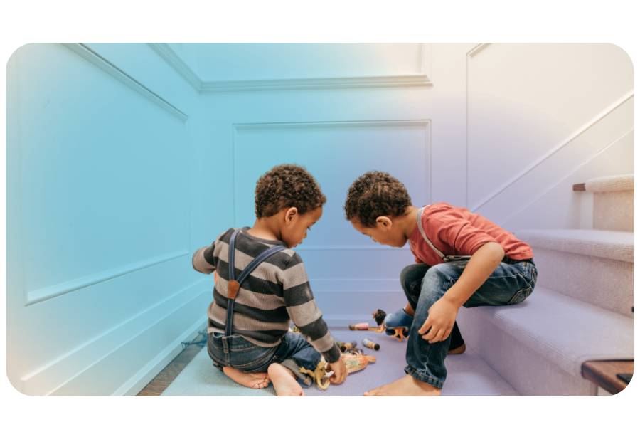 Two siblings playing